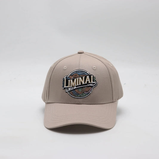 Front view of The TideTurner hat in ivory color made of 65% recycled ocean bound plastic featuring Liminal Life's embroidered logo.