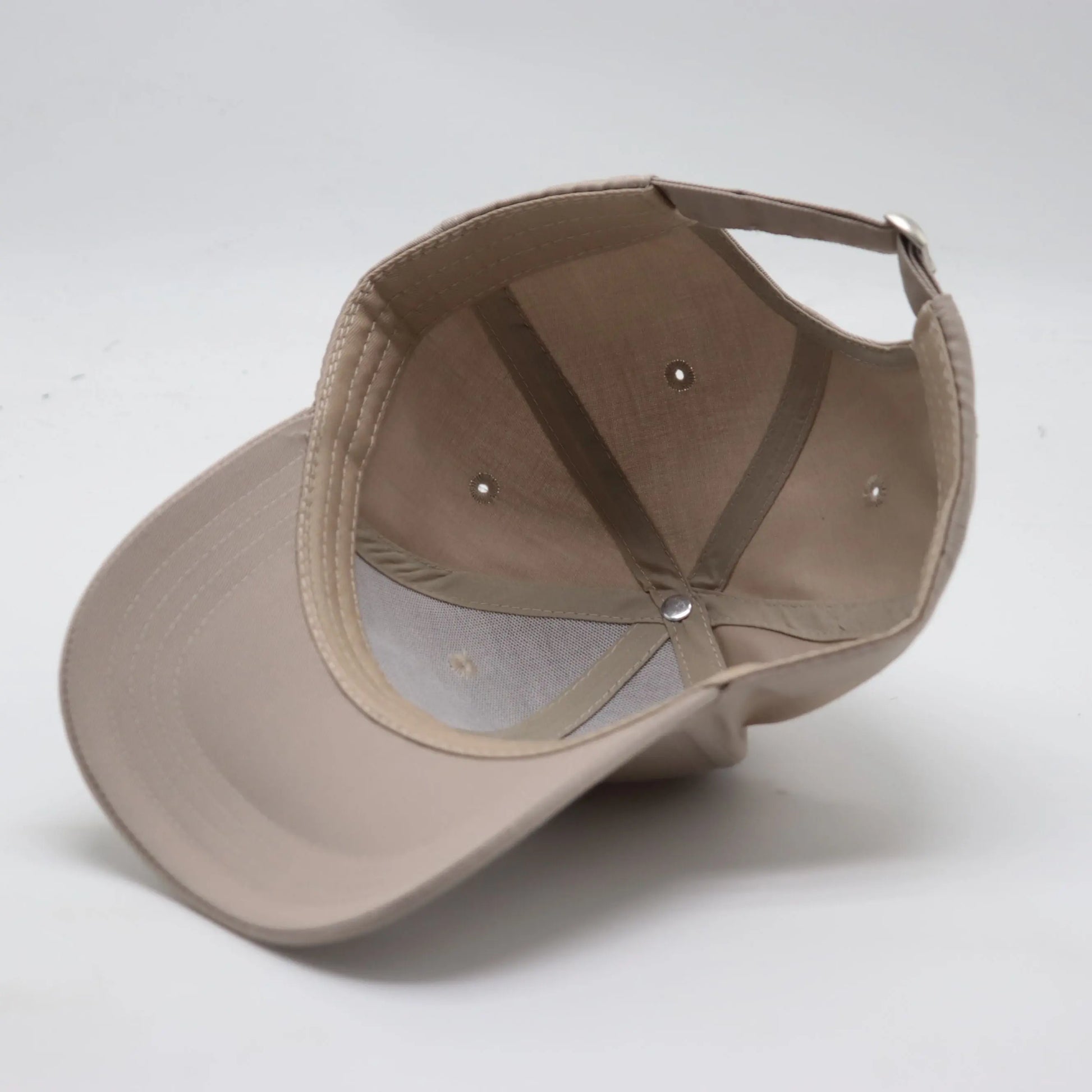 Underside view of The TideTurner hat in ivory color made of 65% recycled ocean bound plastic.